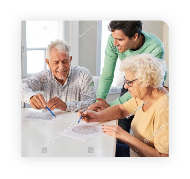 senior-couple-with-son-solving-maze-puzzles-as-memory-training-against-dementia