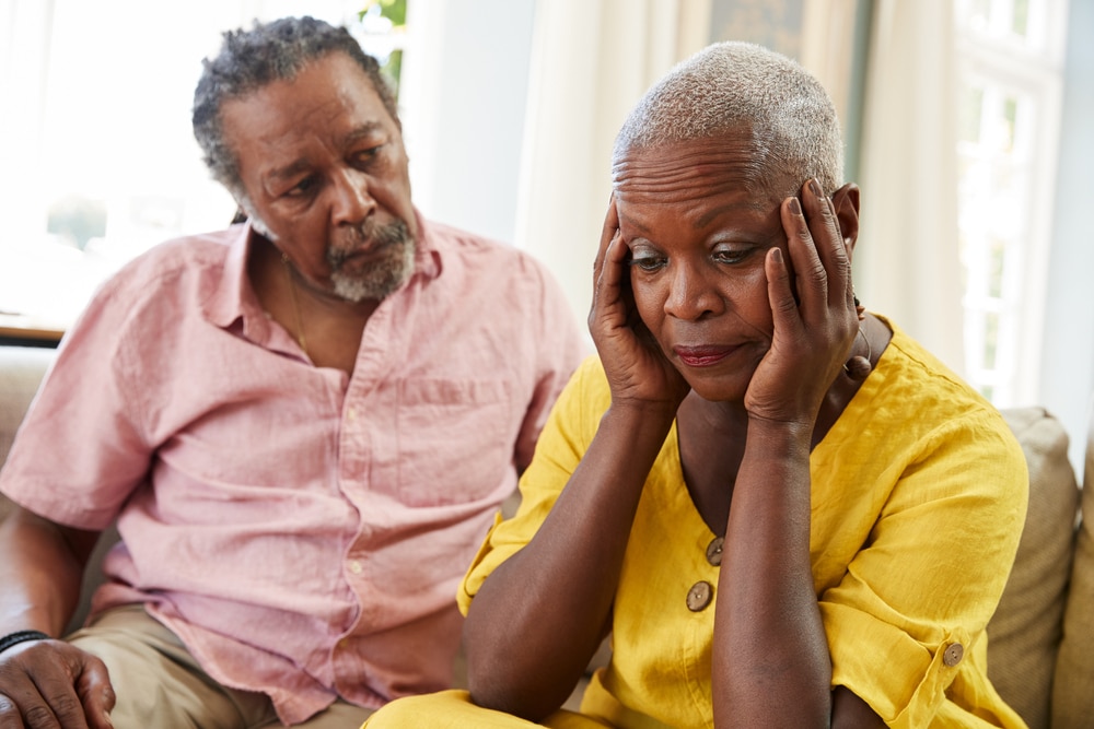 Senior,Man,Comforting,Woman,With,Depression,At,Home